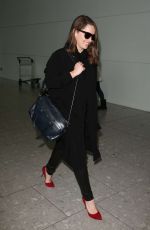 EMILIA CLARKE at Heathrow Airport in London 02/07/2015