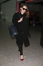 EMILIA CLARKE at Heathrow Airport in London 02/07/2015