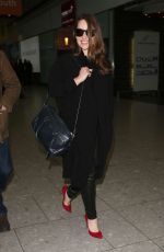 EMILIA CLARKE at Heathrow Airport in London 02/07/2015
