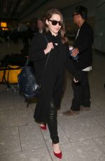 EMILIA CLARKE at Heathrow Airport in London 02/07/2015