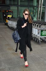 EMILIA CLARKE at Heathrow Airport in London 02/07/2015