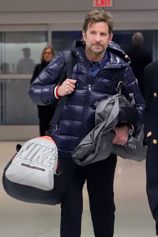 IRINA SHAYK and Bradley Cooper at JFK Airport in New York 02/07/2019