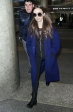 LILY COLLINS at Los Angeles International Airport 02/11/2019