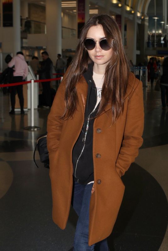 LILY COLLINS at Los Angeles International Airport 02/27/2019