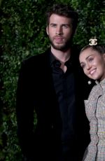 MILEY CYRUS and Liam Hemsworth at Charles Finch and Chanel