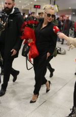 PAMELA ANDERSON Arrives at Airport in Athens 02/24/2019