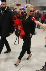 PAMELA ANDERSON Arrives at Airport in Athens 02/24/2019