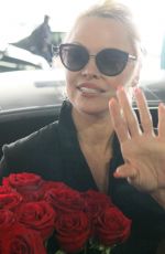 PAMELA ANDERSON Arrives at Airport in Athens 02/24/2019