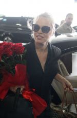 PAMELA ANDERSON Arrives at Airport in Athens 02/24/2019
