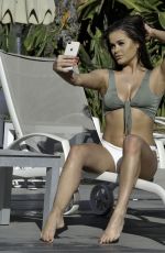 RHAINNE SAXBY in Bikini at a Pool in Spain 02/19/2019