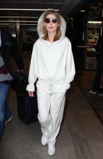 ROSAMUND PIKE Arrives at Airport in Milan 02/23/2019