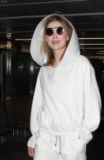 ROSAMUND PIKE Arrives at Airport in Milan 02/23/2019