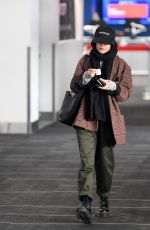 VANESSA HUDGENS and Austin Butler Kissing at LAX Airport in Los Angeles 02/26/2019