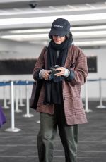 VANESSA HUDGENS and Austin Butler Kissing at LAX Airport in Los Angeles 02/26/2019