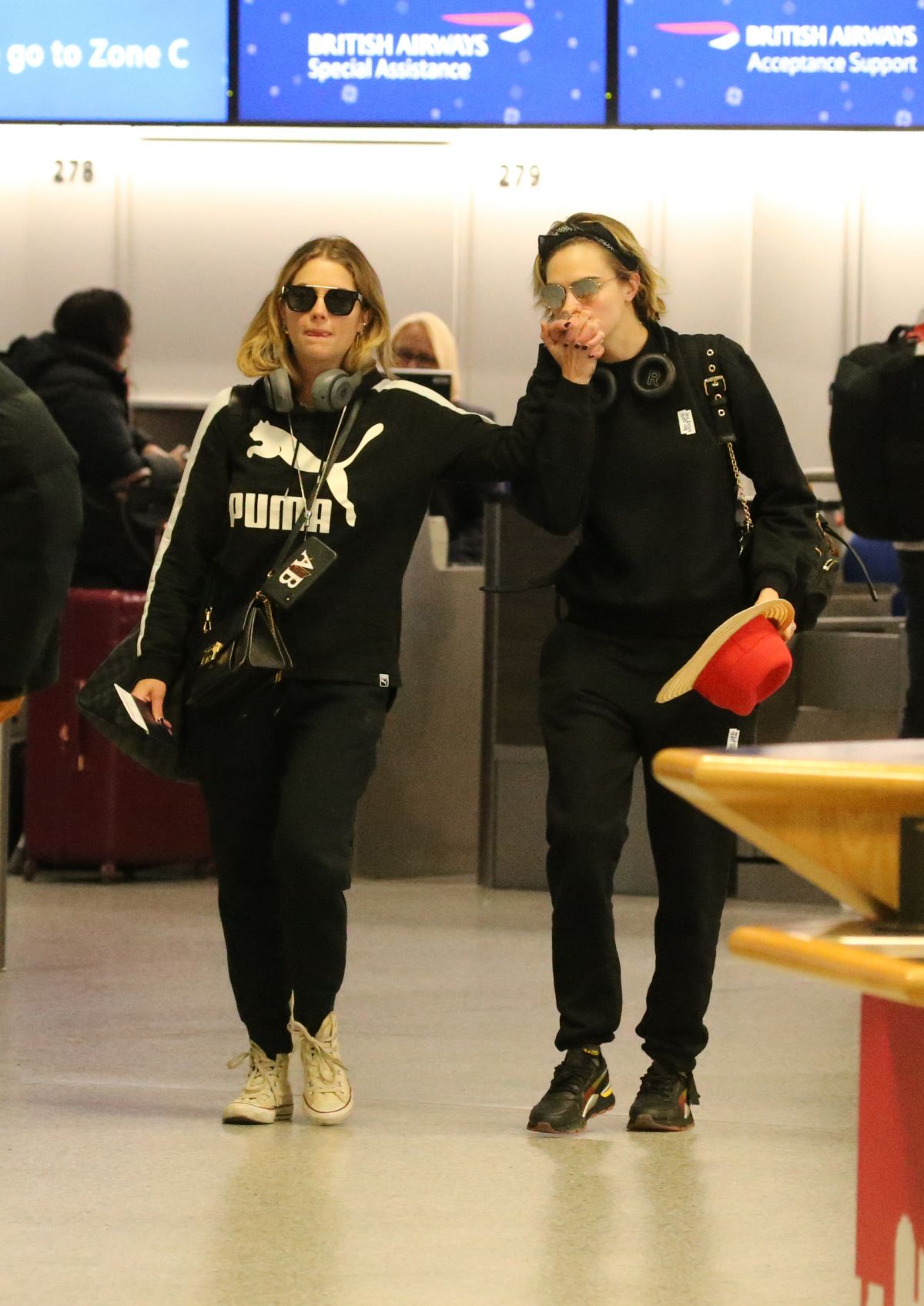 cara-delevingne-and-ashley-banson-at-heathrow-airport-in-london-03-02-2019-0.jpg