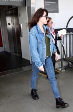 DAKOTA JOHNSON in Double Denim at LAX Airport in Los Angeles 03/01/2019