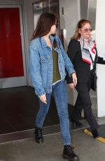 DAKOTA JOHNSON in Double Denim at LAX Airport in Los Angeles 03/01/2019