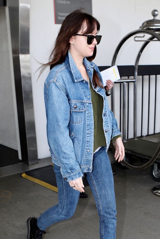 DAKOTA JOHNSON in Double Denim at LAX Airport in Los Angeles 03/01/2019