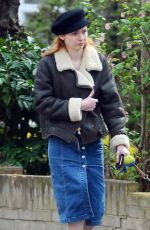 ELEANOR TOMLINSON with Her Dog at a Park in London 03/29/2019