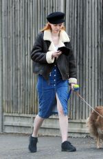 ELEANOR TOMLINSON with Her Dog at a Park in London 03/29/2019