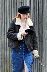 ELEANOR TOMLINSON with Her Dog at a Park in London 03/29/2019