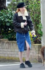 ELEANOR TOMLINSON with Her Dog at a Park in London 03/29/2019