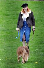 ELEANOR TOMLINSON with Her Dog at a Park in London 03/29/2019