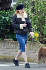 ELEANOR TOMLINSON with Her Dog at a Park in London 03/29/2019