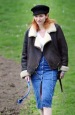 ELEANOR TOMLINSON with Her Dog at a Park in London 03/29/2019