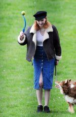 ELEANOR TOMLINSON with Her Dog at a Park in London 03/29/2019