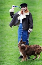 ELEANOR TOMLINSON with Her Dog at a Park in London 03/29/2019