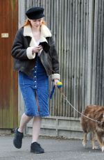 ELEANOR TOMLINSON with Her Dog at a Park in London 03/29/2019