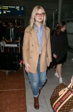 ELLE FANNING at Charles De Gaulle Airport in Paris 03/02/2019