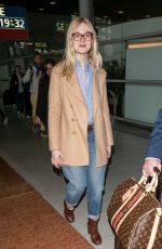 ELLE FANNING at Charles De Gaulle Airport in Paris 03/02/2019