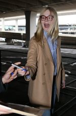 ELLE FANNING at Charles De Gaulle Airport in Paris 03/02/2019