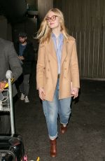 ELLE FANNING at Charles De Gaulle Airport in Paris 03/02/2019