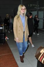 ELLE FANNING at Charles De Gaulle Airport in Paris 03/02/2019