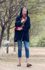 IRELAND BALDWIN out with her Dog at a Park in Los Angeles 03/19/2019