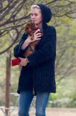 IRELAND BALDWIN out with her Dog at a Park in Los Angeles 03/19/2019