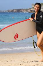 MADDY KING in Wetsuit Surfing at Bondi Beach 03/30/2019