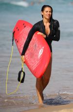MADDY KING in Wetsuit Surfing at Bondi Beach 03/30/2019
