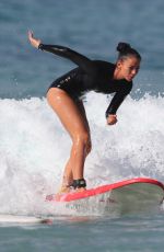 MADDY KING in Wetsuit Surfing at Bondi Beach 03/30/2019