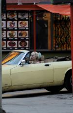 MARGOT RPBBIE in Yellow Jaguar on the Set of Birds of Prey in Los Angeles 03/28/2019