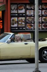 MARGOT RPBBIE in Yellow Jaguar on the Set of Birds of Prey in Los Angeles 03/28/2019