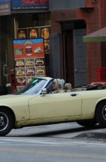 MARGOT RPBBIE in Yellow Jaguar on the Set of Birds of Prey in Los Angeles 03/28/2019