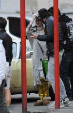 MARGOT RPBBIE in Yellow Jaguar on the Set of Birds of Prey in Los Angeles 03/28/2019