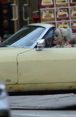 MARGOT RPBBIE in Yellow Jaguar on the Set of Birds of Prey in Los Angeles 03/28/2019