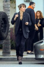 MILLA JOVOVICH Leaves Spago in Beverly Hills 03/07/2019