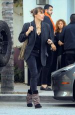 MILLA JOVOVICH Leaves Spago in Beverly Hills 03/07/2019