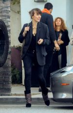 MILLA JOVOVICH Leaves Spago in Beverly Hills 03/07/2019